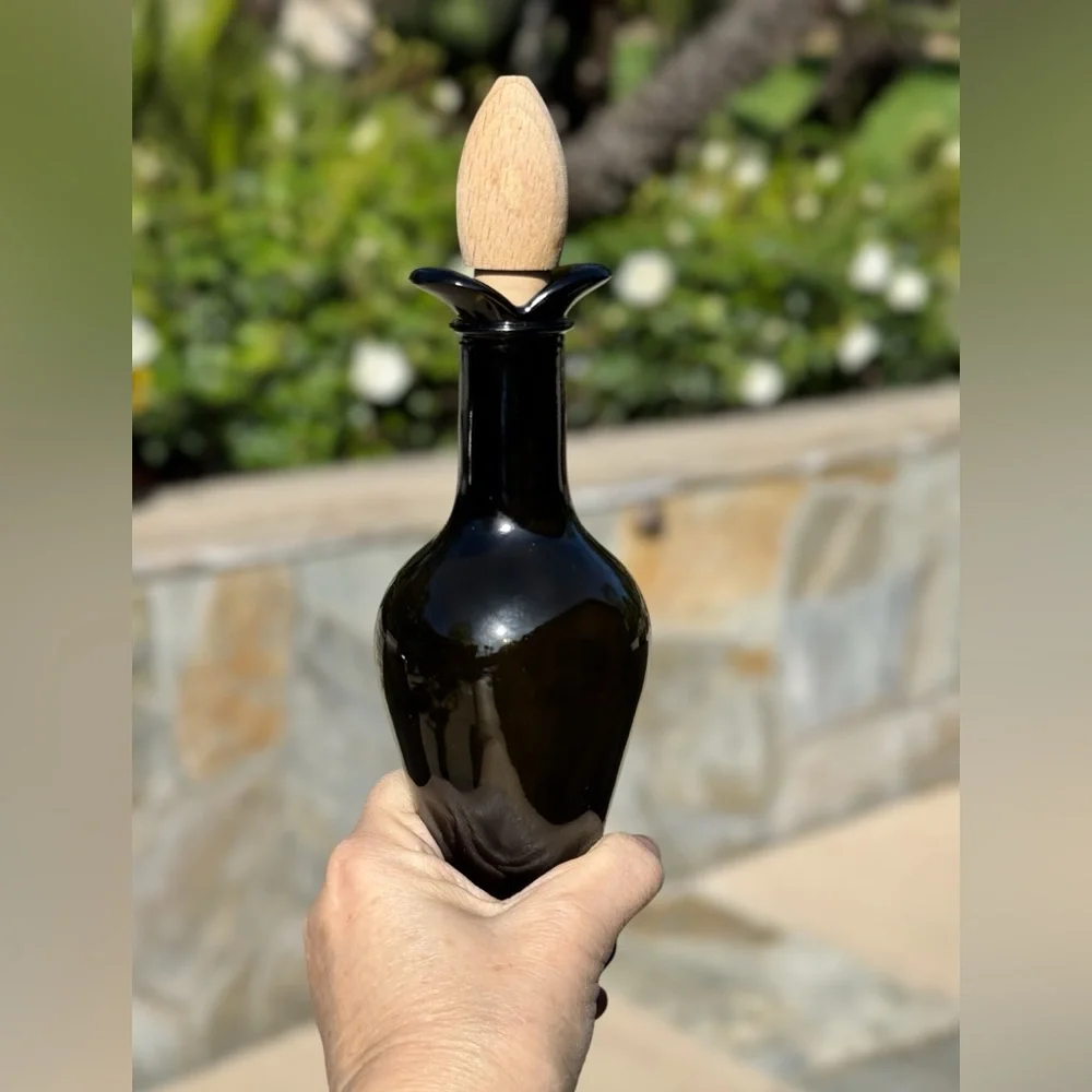 Tulip shaped dark green oil/vinegar cruet with wooden stopper